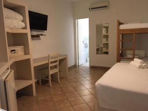 Cama ou camas em um quarto em Pousada Villa Maritima