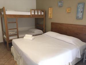Cama ou camas em um quarto em Pousada Villa Maritima