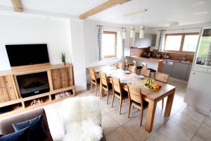 a kitchen and dining room with a table and chairs at Chalet Melodie in Ehrwald