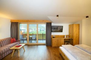 Postel nebo postele na pokoji v ubytování Appartement-Pension Kendlbacher