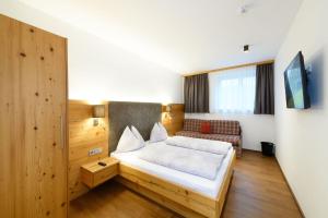 Postel nebo postele na pokoji v ubytování Appartement-Pension Kendlbacher