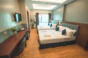 Postel nebo postele na pokoji v ubytování Henia Hotel + 37 fotografií