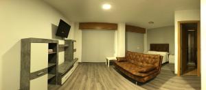 TV a/nebo společenská místnost v ubytování Apartamentos Augusto