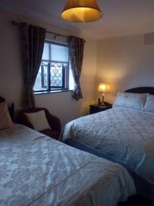 Voodi või voodid majutusasutuse Corrib View Guesthouse h91rr72 toas