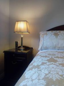 Voodi või voodid majutusasutuse Corrib View Guesthouse h91rr72 toas