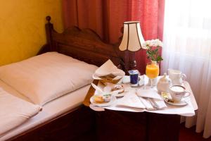 Postel nebo postele na pokoji v ubytování Hotel Retman