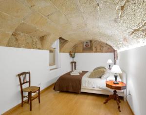 Postel nebo postele na pokoji v ubytování Ramón Llull House