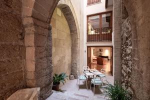 a large room with a table and chairs in it at Ramón Llull House in Palma de Mallorca