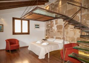 Postel nebo postele na pokoji v ubytování Ramón Llull House