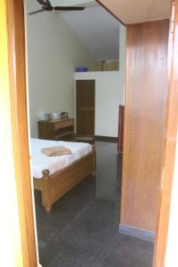 Rúm í herbergi á Dsilva Residence
