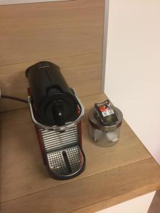 a gaming system sitting on top of a drawer at Studio Peralta in Liège