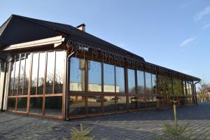a building with a lot of glass windows on it at Holiday stay Nika in Busk