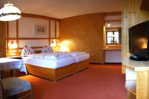 En eller flere senger på et rom på Hotel-Gasthof "Zur Mühle"