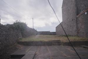 an alley in a castle with a stone wall at Townhouse on the Spital in Aberdeen
