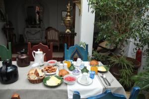 a table with a breakfast of food on it at El Patio Courtyard House in Tunis +23 photos