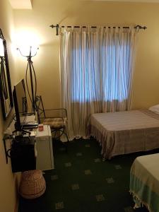 Postel nebo postele na pokoji v ubytování A&B Home Hotel