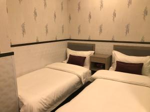 Postelja oz. postelje v sobi nastanitve Vve Vve Hotel
