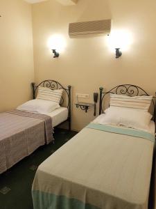Postel nebo postele na pokoji v ubytování A&B Home Hotel