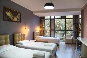 Postel nebo postele na pokoji v ubytování Hotel Relax