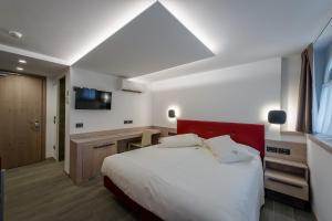 Posteľ alebo postele v izbe v ubytovaní Hotel Ambra