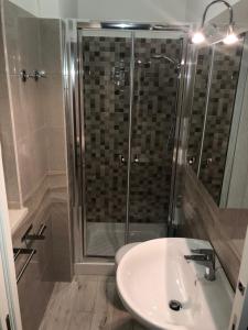 a bathroom with a shower and a white sink at Casa Vacanze De Nittis - Meridia Collection in Barletta +20 photos