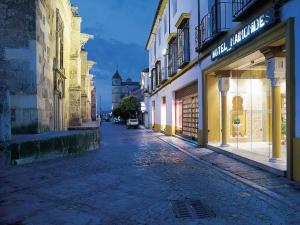 a city street filled with lots of buildings at Eurostars Maimonides in Córdoba