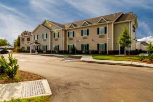 a large house on the side of a street at Mt. Rose Hotel in Fayetteville