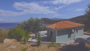 a small house with a view of the ocean at Villa Platanaki in Kerveli