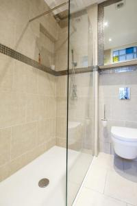 a bathroom with a shower and a toilet at Old Town Kalēju Street in Rīga