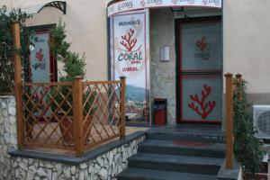 a building with a gate and stairs in front of it at Coral Rooms in Torre del Greco