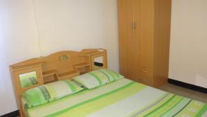 מיטה או מיטות בחדר ב-De Kolibrie Appartementen