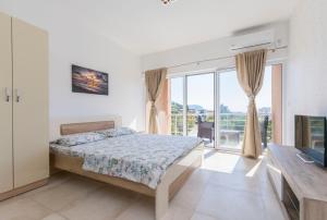 Postel nebo postele na pokoji v ubytování Apartments DILARA