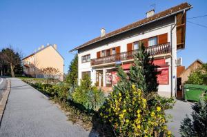 a house with a garden in front of it at Room Anton in Rakovica