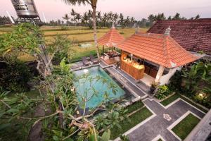 an aerial view of a house with a swimming pool at Griya Private Villa in Ubud +27 photos