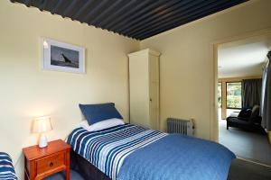 Postel nebo postele na pokoji v ubytování Sails Motel