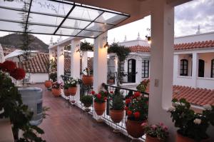 Un balcón o terraza de El Hotel de Su Merced