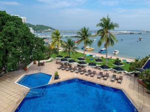 an aerial view of a swimming pool and a beach at Siam Bayshore Resort Pattaya in Pattaya South