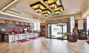 a lobby of a hotel with a restaurant at Jia Hsin Garden Hotel in Tainan