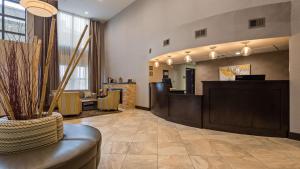 a salon with a waiting room with a reception desk at Best Western New Albany in New Albany