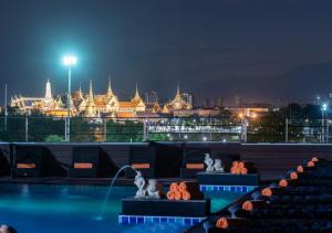 a view of a city skyline at night at D&D Inn Khaosan in Bangkok
