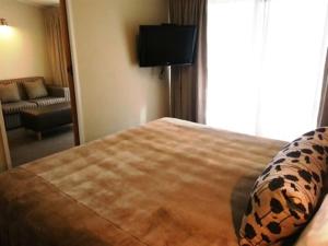 Postel nebo postele na pokoji v ubytování Marineland Motel