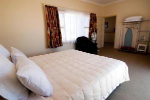 Postel nebo postele na pokoji v ubytování Marineland Motel