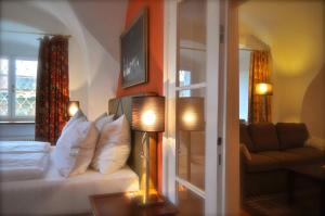 a living room with a couch and a window at Schlosshotel Mailberg in Mailberg