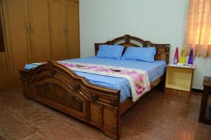 Postel nebo postele na pokoji v ubytování Coimbatore Home Stay & Serviced Apartment + 35 fotografií