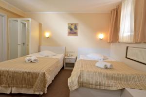 Postel nebo postele na pokoji v ubytování light hotel & hub
