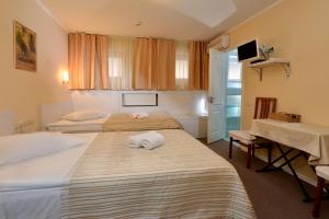 Postel nebo postele na pokoji v ubytování light hotel & hub