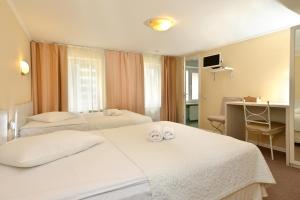 Postel nebo postele na pokoji v ubytování light hotel & hub