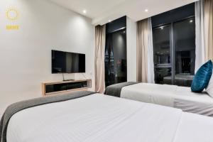 Postel nebo postele na pokoji v ubytování Expressionz Suites By iHost Global