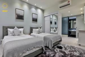 Posteľ alebo postele v izbe v ubytovaní Expressionz Suites By iHost Global