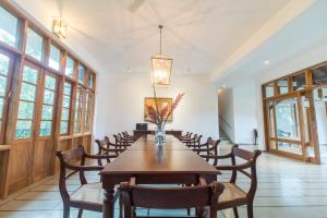 a large dining room with a table and chairs at Niketh Villa Kandy in Kandy